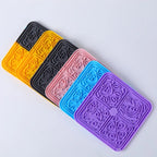 Lick mats stacked in several colors
